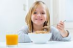 Beautiful Child Having Breakfast At Home Stock Photo