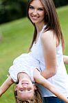 Mother And Daughter Having Fun Outdoors Stock Photo